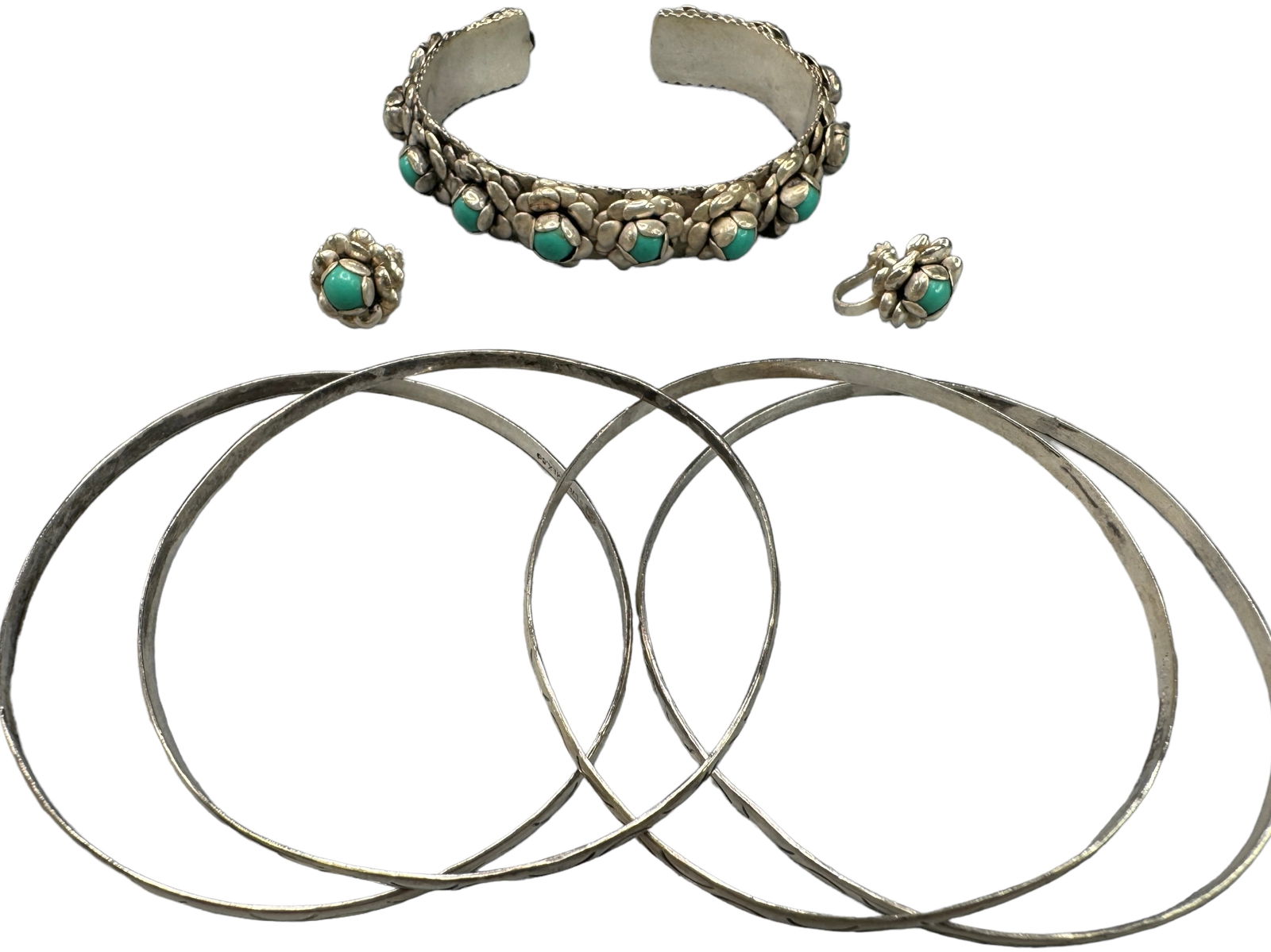 Unique Vintage Sterling & Turquoise Set, Bangles: Vintage 925 Rosette with turquoise centers set. Includes a cuff and matching screw-back earrings. 4 Mexican silver marked 3.5mm wide bangles. All weigh 36.54 DWT.
