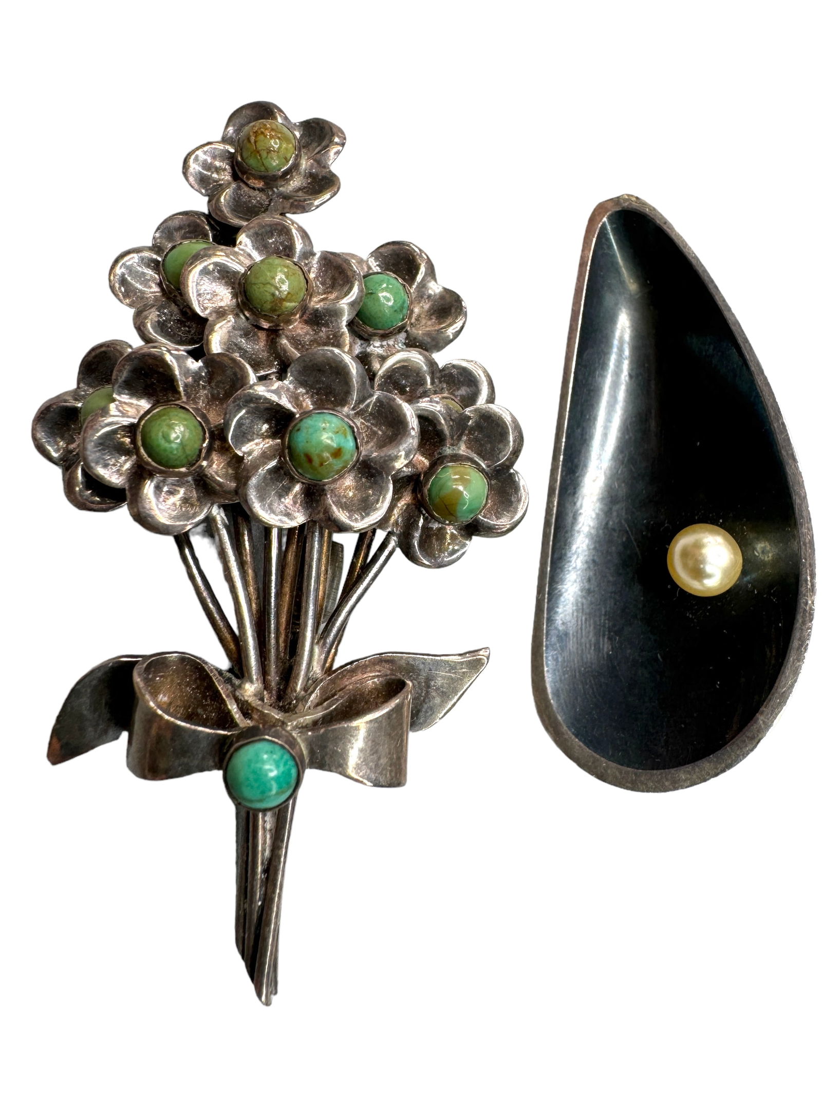 Taxco Delfine 925 Pearl & Silver Turquoise: Two Vintage Mexican brooches. Delfine Taxco 925 leaf brooch with faux pearl set. 2 inches in length. Mexican silver flower bunch brooch with turquoise accents. 2.5 inches in length. Both weigh 16.65 D