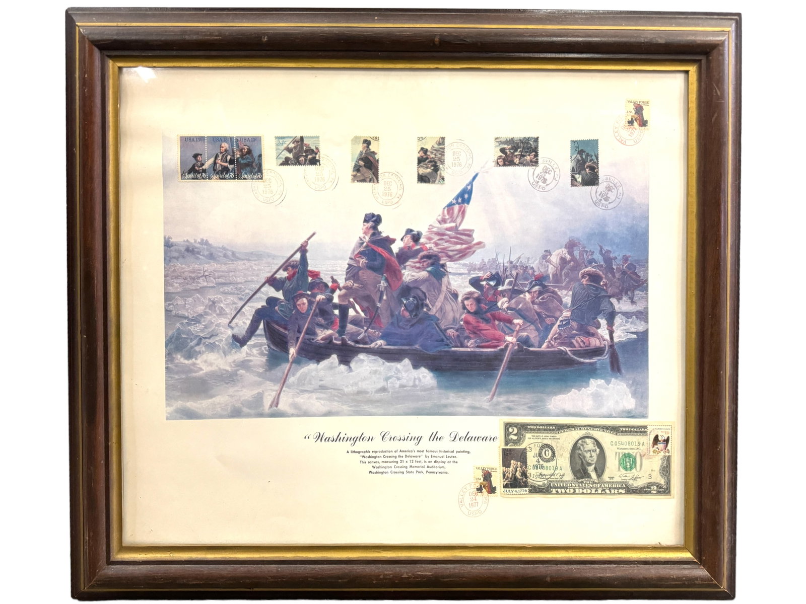 Litho Repro Washington On The Delaware, Stamps $2: Litho print of the famous painting of Washington crossing the Delaware River by Emanual Leutze. Includes a 1976 Series 2$ bill, and several stamps as shown. Glass framed and measures 24 x 19.5 inches.