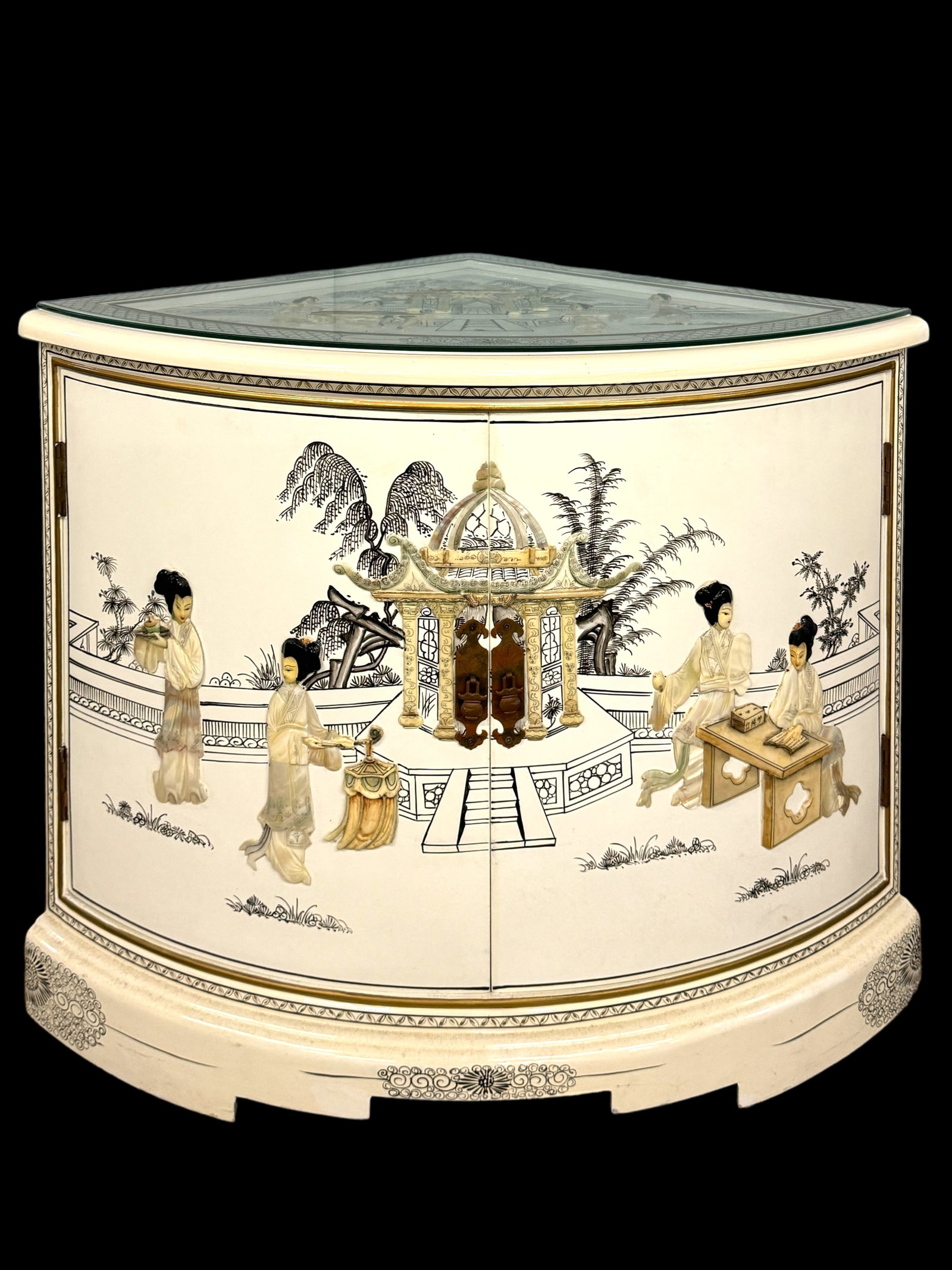 Vintage White Lacquered MOP Asian Corner Cabinet: Vintage white lacquered Asian / Chinoiserie style corner cabinet. Hand painted details with applied mother of pearl, resin decoration. Glass topper and one hinged curved door. Stands 24.5 inches and i