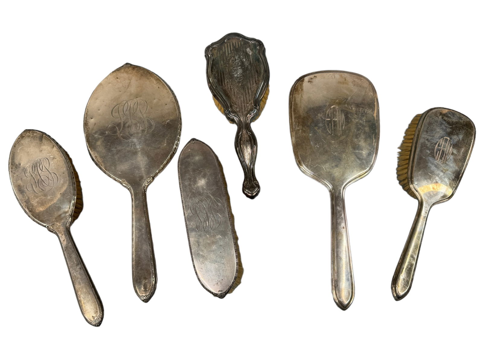 Victorian Sterling & Plated Handled Grooming Sets: Matching monogrammed presumed sterling 3 piece set with 12 inch hand mirror, 9.75 inch brush, and a 7.25 inch clothing brush. Unmarked. 2 piece matching Gorham set with a 12 inch hand mirror and 9.5 i