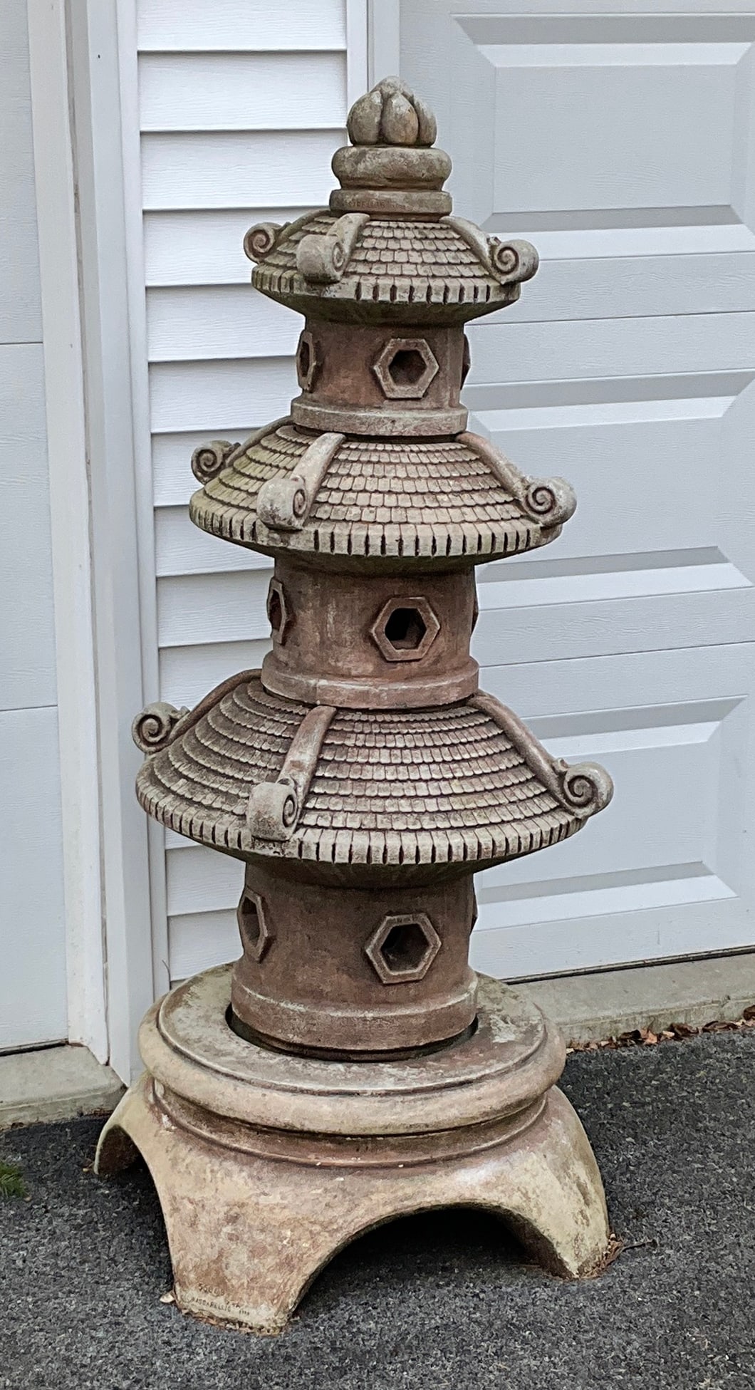 Four piece pagoda / lantern style concrete statue: measuring approximately 60 inches in overall height with a base approximately 24 inches square. ***Statue is extremely heavy. Auction Company will assist in loading with heavy machinery onto a truck o