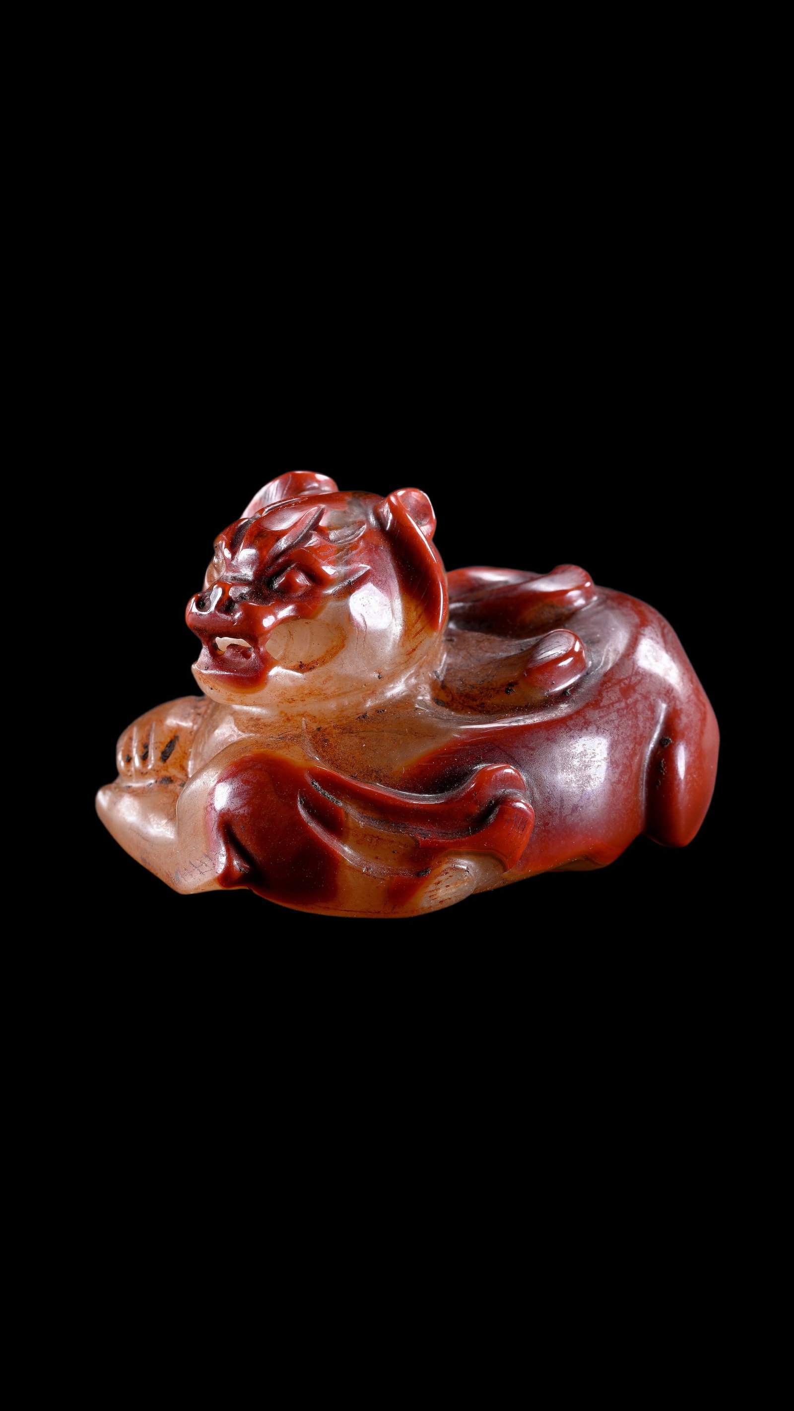 A Reddish Jade Mythical Beast Carving, Han, Circa 2nd C BC?C2nd C AD Pr.: Size:(Height4cm Length 6cm) Shipping:EU\HK\USA Ondoor shipping estimation:75EUR Condition:(Good Condition, No Repairment Checked by UV&Strong Light, Age Traces) Terms:(It is the Buyer's responsibility