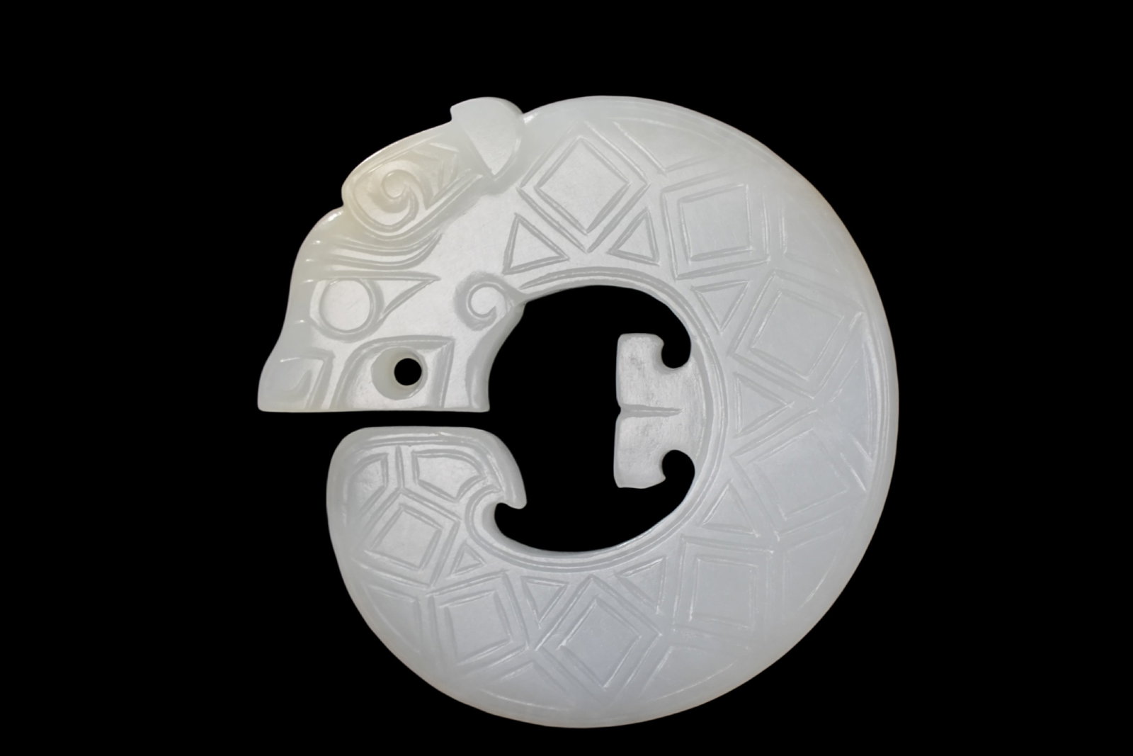 A Jade ornament, 2th- 12th Pr.: Size:(Length5.3cm, Width5.2cm, Depth0.7cm) Shipping:EU\HK\USA Ondoor shipping estimation:75EUR Condition:(Good Condition, No Repairment Checked by UV&Strong Light, Age Traces) Terms:(It is the Buyer's