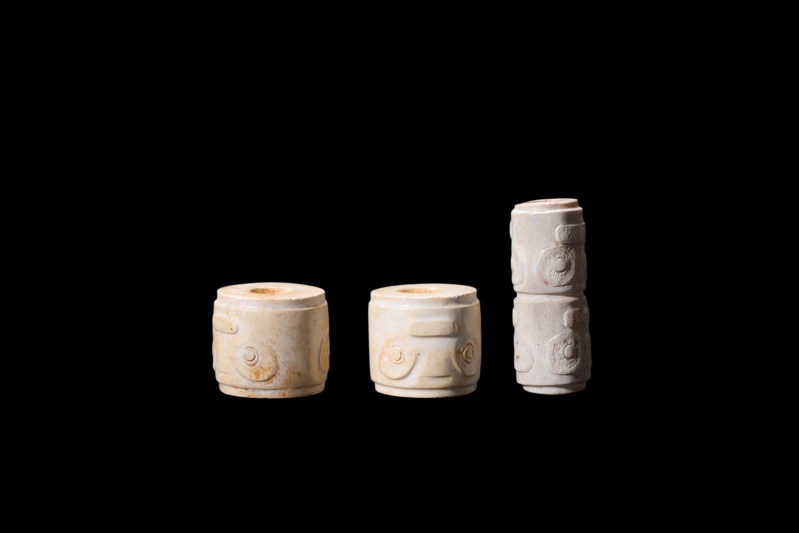 A Three Calcified White Jade Human-Face Beads, Liangzhu, Circa 3300?C2300 C BC Pr.: Size:(Height2.5cm Height2.5cm Height4cm ) Shipping:EU\HK\USA Ondoor shipping estimation:75EUR Condition:(Good Condition, No Repairment Checked by UV&Strong Light, Age Traces) Terms:(It is the Buyer's 
