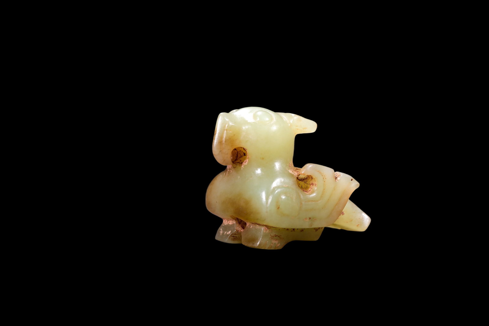 A Pale Yellow Jade Recumbent Bird Carving, Late Shang, Circa 12th?C11th C BC Pr. (1 of 4)