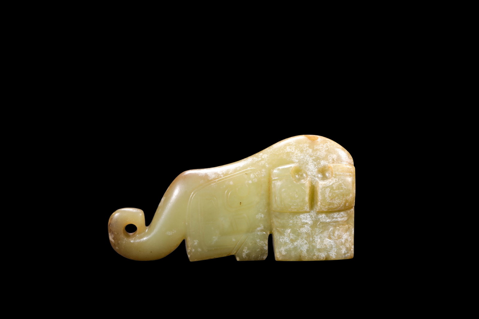 A Pale Calcified Jade Elephant Pendant, Late Shang, Circa 12th?C11th C BC Pr.: Size:(Length 7.8cm ) Shipping:EU\HK\USA Ondoor shipping estimation:75EUR Condition:(Good Condition, No Repairment Checked by UV&Strong Light, Age Traces) Terms:(It is the Buyer's responsibility to ins
