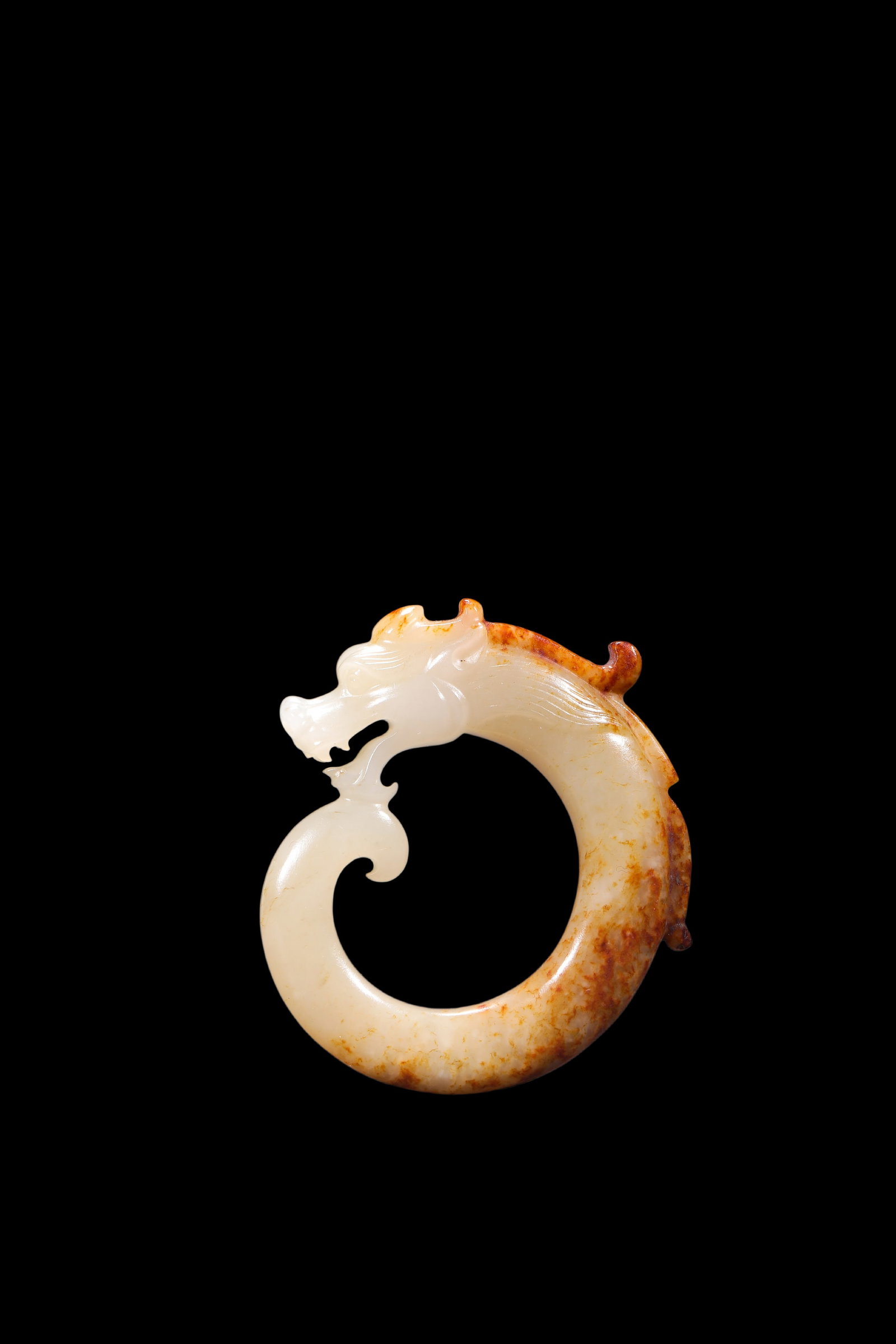 A White Jade C-Shaped Dragon Pendant with Russet Veins, Han, Circa 2nd C BC?C2nd C AD Pr. (1 of 3)