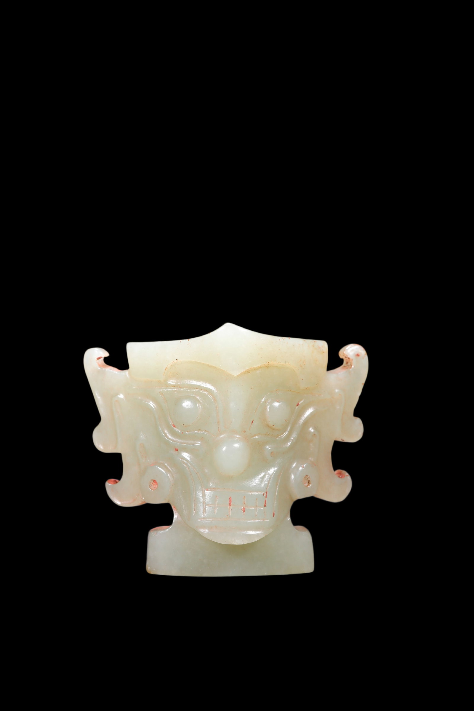 A Pale Celadon Jade Taotie Mask Pendant, Shang, Circa 13th?C11th C BC Pr.: Size:(Height5.7cm ) Shipping:EU\HK\USA Ondoor shipping estimation:75EUR Condition:(Good Condition, No Repairment Checked by UV&Strong Light, Age Traces) Terms:(It is the Buyer's responsibility to insp