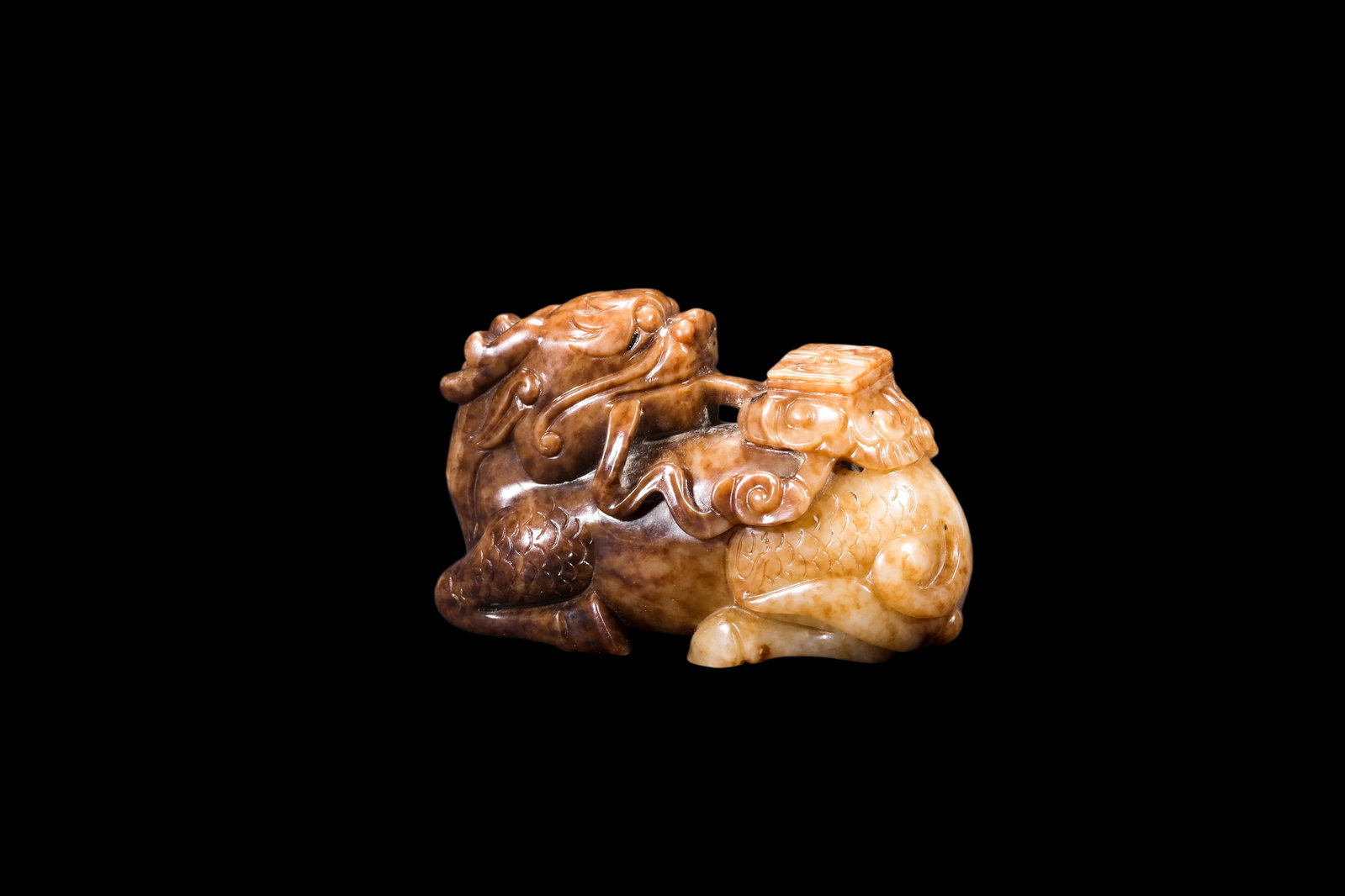 A Mottled Russet Jade Qilin Carving, Ming, Circa 1368?C1644 AD Pr.: Size:(Length 7cm ) Shipping:EU\HK\USA Ondoor shipping estimation:75EUR Condition:(Good Condition, No Repairment Checked by UV&Strong Light, Age Traces) Terms:(It is the Buyer's responsibility to inspe