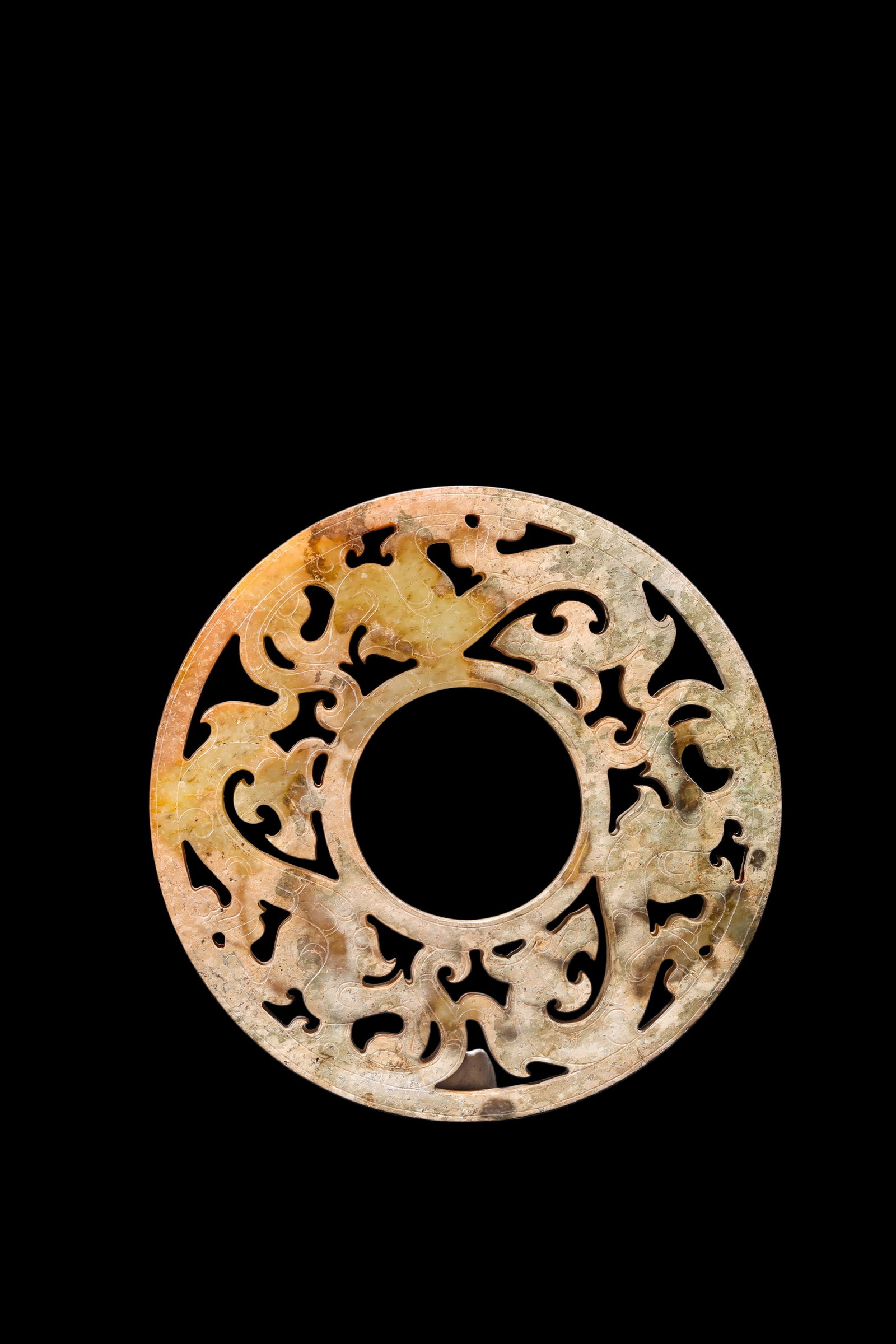 A Calcified Yellow Jade Openwork Dragon Bi Disc, Han, Circa 2nd C BC?C2nd C AD Pr.: Size:(Width8.3cm ) Shipping:EU\HK\USA Ondoor shipping estimation:75EUR Condition:(Good Condition, No Repairment Checked by UV&Strong Light, Age Traces) Terms:(It is the Buyer's responsibility to inspe