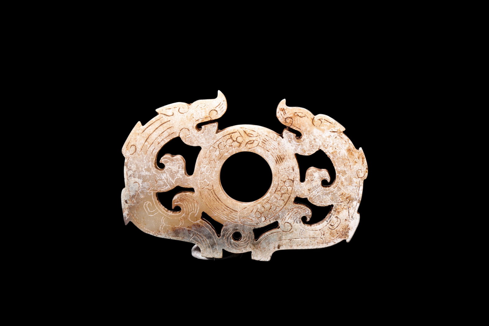 A Calcified Pale Jade Twin Dragon Openwork Pendant, Han, Circa 2nd C BC?C2nd C AD Pr.: Size:(Length 7cm ) Shipping:EU\HK\USA Ondoor shipping estimation:75EUR Condition:(Good Condition, No Repairment Checked by UV&Strong Light, Age Traces) Terms:(It is the Buyer's responsibility to inspe