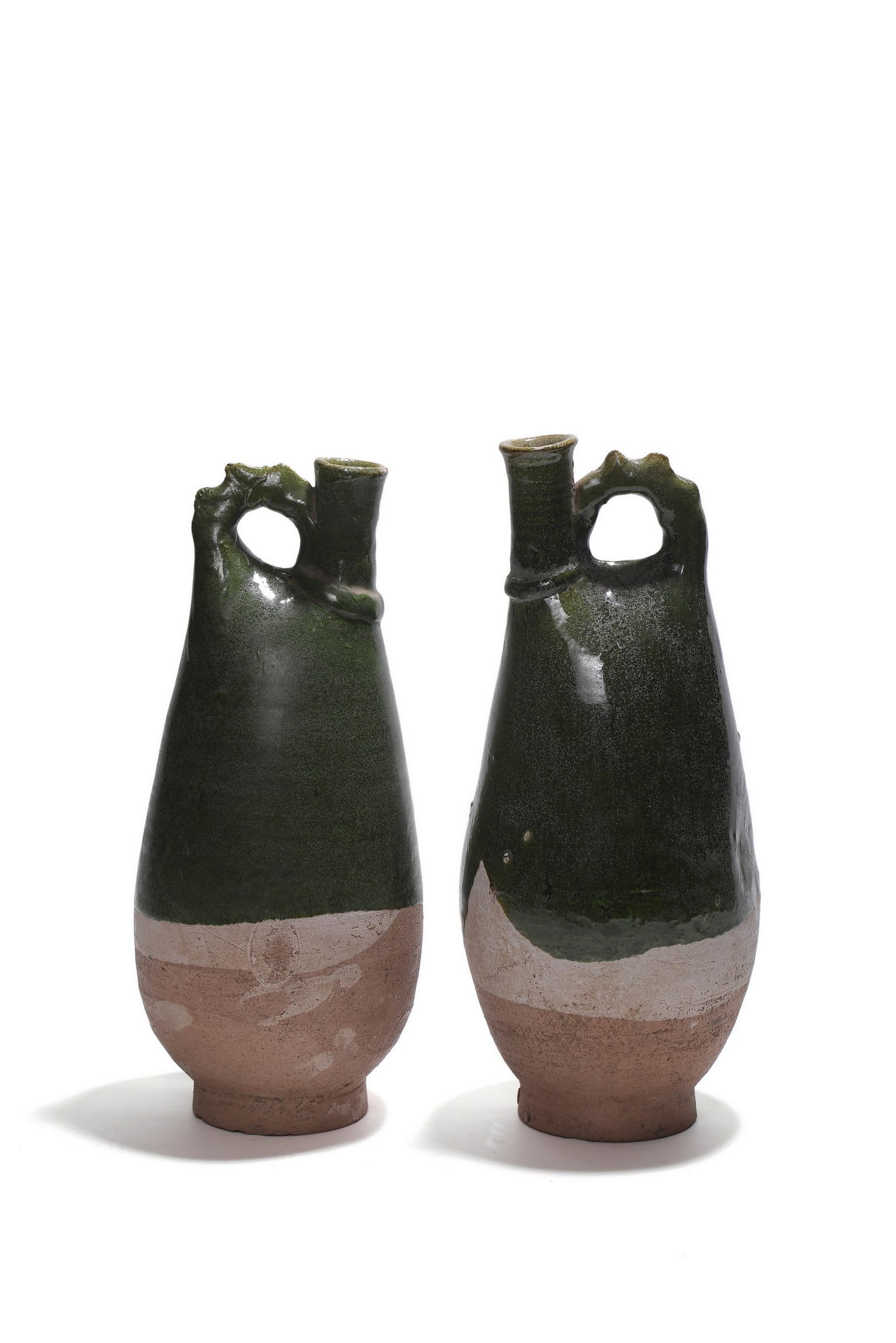 A Chinese Ancient pair of green?glazed phoenix?handle ewers, 10th?12th centuries A.D Pr. (1 of 5)