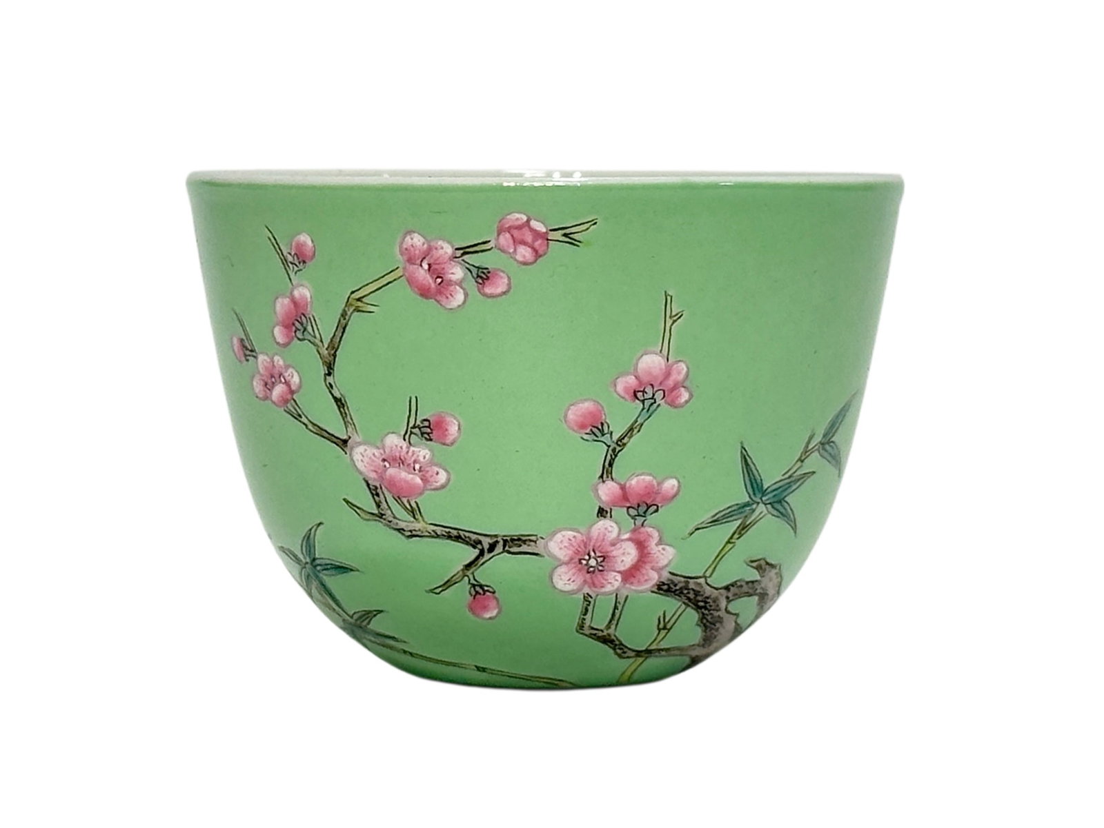 A Chinese Green ground famille rose cup with plum blossoms motif, YongZheng Pr.: Size:(Height4.5cm, Mouth Diameter6.3cm) Shipping:EU\HK\USA Ondoor shipping estimation:75EUR Condition:(Good Condition, No Hairlines, No Cracks, No Repairment Checked by UV&Strong Light, Age Traces) Te