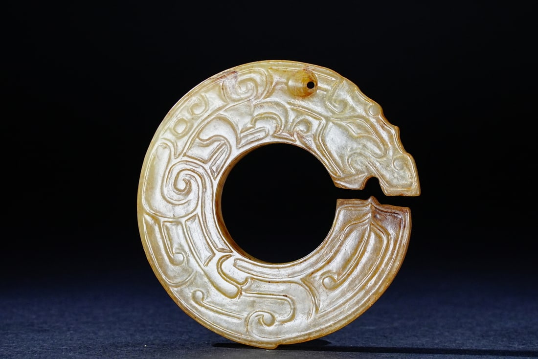 A Chinese jade ornament, 12th Pr.: Size:(Diameter5.1cm, Depth.58cm) Shipping:EU\HK\USA Ondoor shipping estimation:75EUR Condition:(Good Condition, No Repairment Checked by UV&Strong Light, Age Traces) Terms:(It is the Buyer's responsib