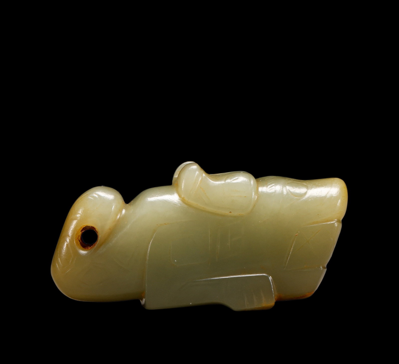 A Celadon?Green Jade Recumbent Crouching Beast Pendant with Dual Piercings, 16th?11th BCE Pr.: Size:(Width6cm) Shipping:EU\HK\USA Ondoor shipping estimation:70EUR Condition:(Good Condition, No Repairment Checked by UV&Strong Light, Age Traces) Terms:(It is the Buyer's responsibility to inspect