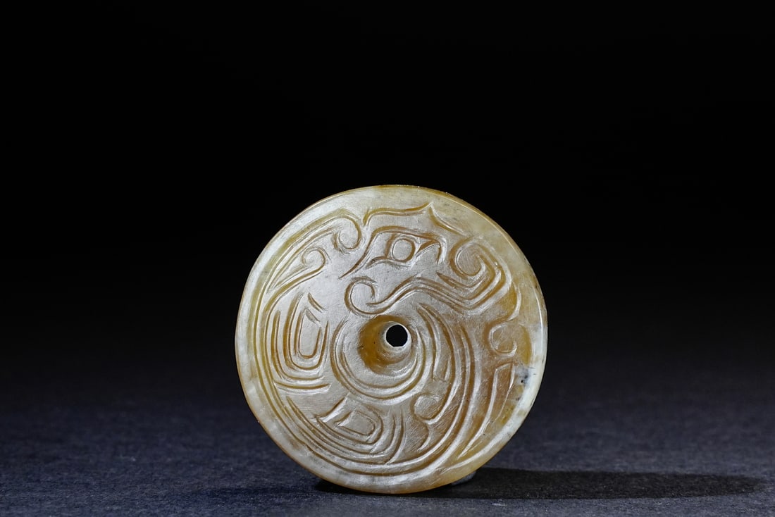 A Chinese jade ornament, 12th Pr.: Size:(Diameter3.4, Depth0.63cm) Shipping:EU\HK\USA Ondoor shipping estimation:70EUR Condition:(Good Condition, No Repairment Checked by UV&Strong Light, Age Traces) Terms:(It is the Buyer's