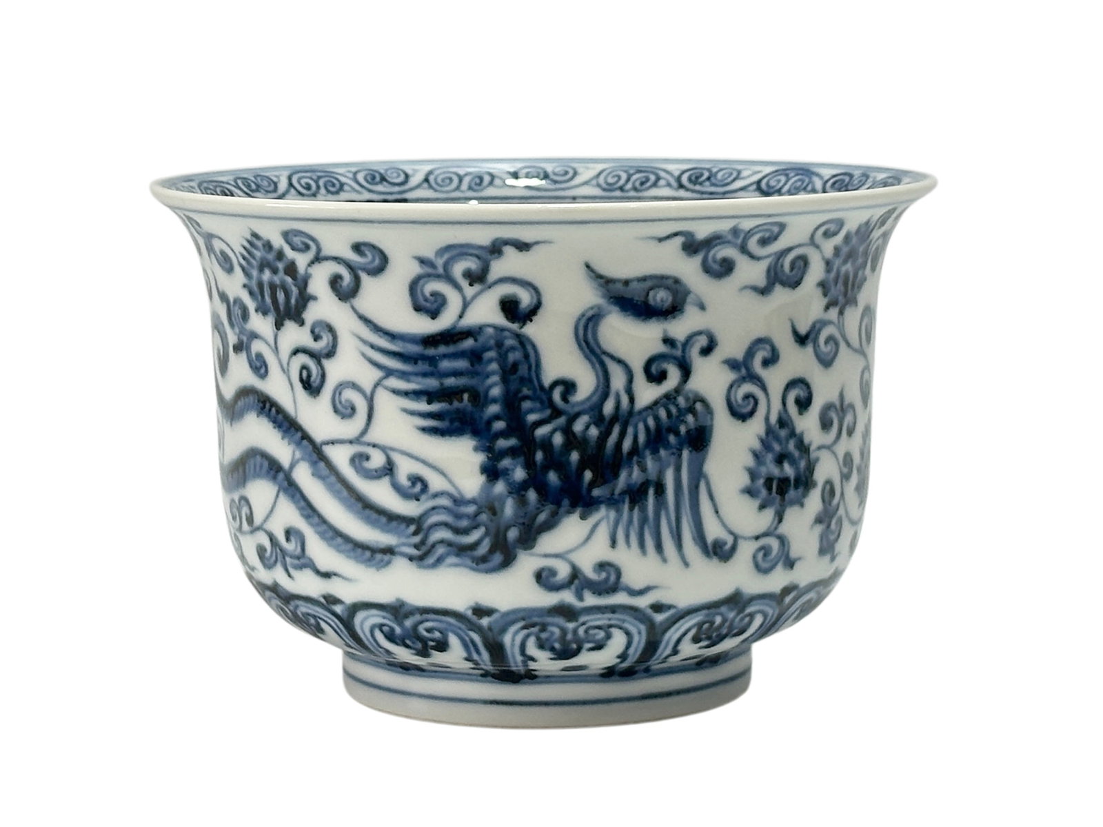 A Chinese Blue-and-white phoenix and flower deco bowl, Ming Dynasty Pr.: Size:(Height10.5cm, Mouth Diameter16cm) Shipping:EU\HK\USA Ondoor shipping estimation:115EUR Condition:(Good Condition, No Hairlines, No Cracks, No Repairment Checked by UV&Strong Light, Age Traces) T