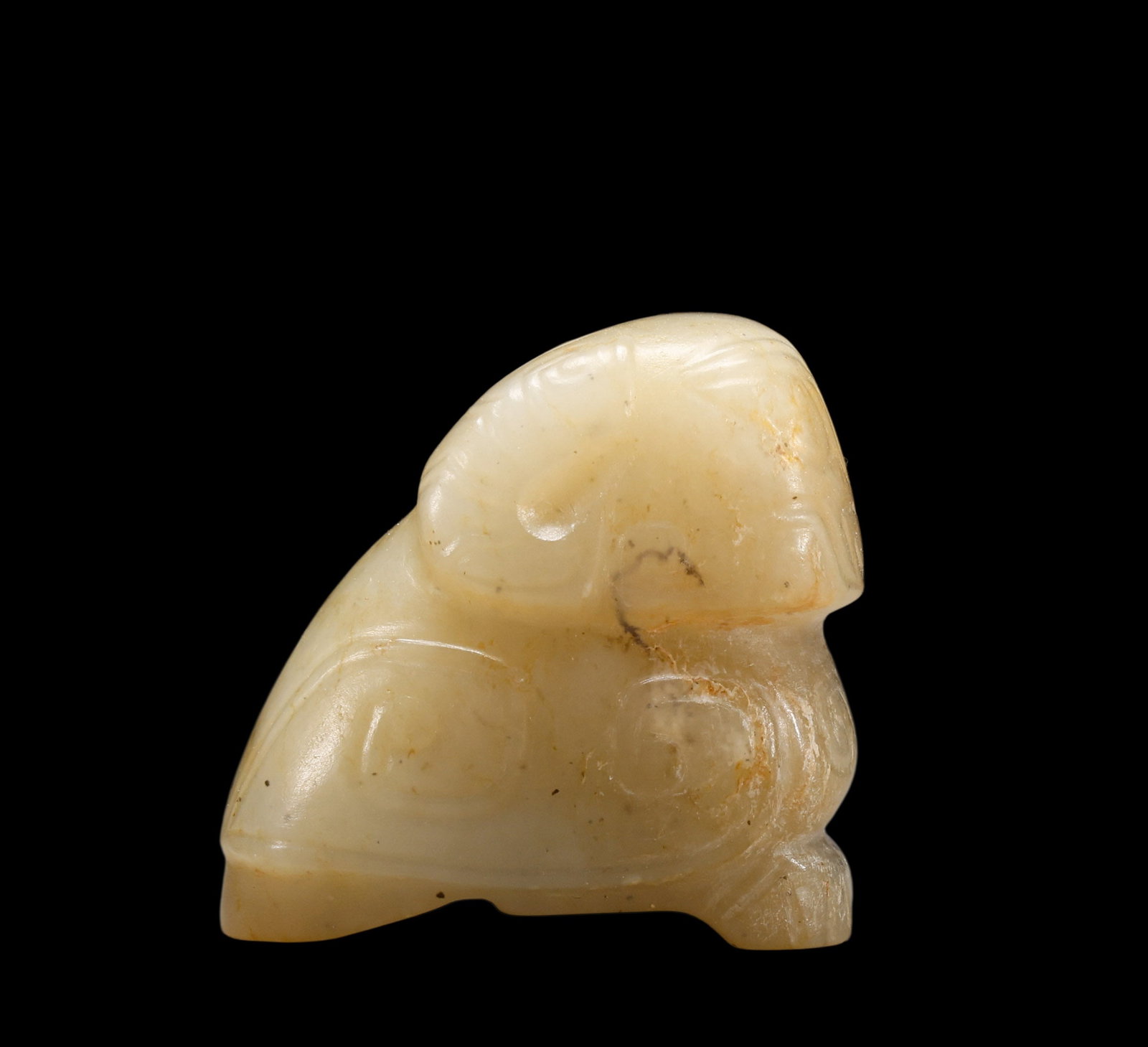 A Creamy?White Jade Crouching Ram Pendant Incised with Archaic Scroll Patterns, 16th?11th BCE Pr. (1 of 5)
