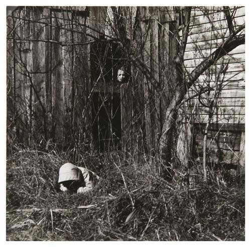 Ralph Eugene Meatyard (1925-1972) Untitled (two bo: Ralph Eugene Meatyard (1925-1972) Untitled (Two Boys Hiding), ca. 1960Gelatin silver print. Signed by Madelyn O. Meatyard in ink on the verso. 7 1/4 x 7 1/2 in. (18.4 x 19.1 cm.)