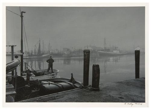 A. Aubrey Bodine (1906-1970) Ocean City Fish Dock: A. Aubrey Bodine (1906-1970) Ocean City Fish Dock, ca. 1950Toned gelatin silver print. Signed in ink in the margin. 12 3/8 x 17 3/4 in. (31.4 x 45.1 cm.) Literature: Bodine, ed., Bodine's Che