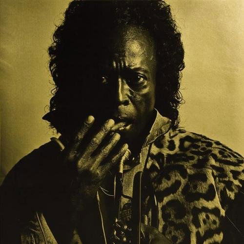 Michel Comte (b. 1954) "Miles Davis, 1991: Michel Comte (b. 1954) "Miles Davis, 1991""Gold selenium toned gelatin silver print. Signed, titled, dated and inscribed in ink with credit stamp on the verso. 15 1/2 x 15 1/2 in. (39.6 x 39.6