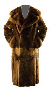 GOREY, Edward (1925 - 2000) Fur Coat owned and wor: GOREY, Edward (1925 - 2000) Fur Coat owned and worn by Edward GoreyOtter with sable trim coat, double-breasted, unmatched skin, brown silk lining, floor length. Label sewn in celebrating the 2010
