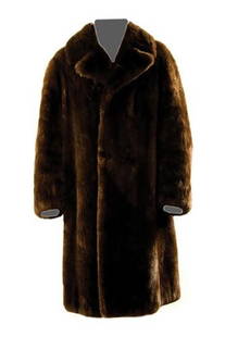 GOREY, Edward (1925 - 2000) Fur Coat owned and wor: GOREY, Edward (1925 - 2000) Fur Coat owned and worn by Edward GoreyOtter coat by Ritter Sport with dark brown silk lining, just below the knee, no buttons. Label sewn in celebrating the 2010 Annual