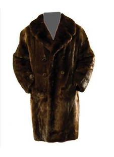 GOREY, Edward (1925 - 2000) Fur Coat owned and wor: GOREY, Edward (1925 - 2000) Fur Coat owned and worn by Edward GoreyOtter coat, dark brown with black silk lining, double-breasted with buttons, knee length. Inscribed "Sam R" in cursive lettering