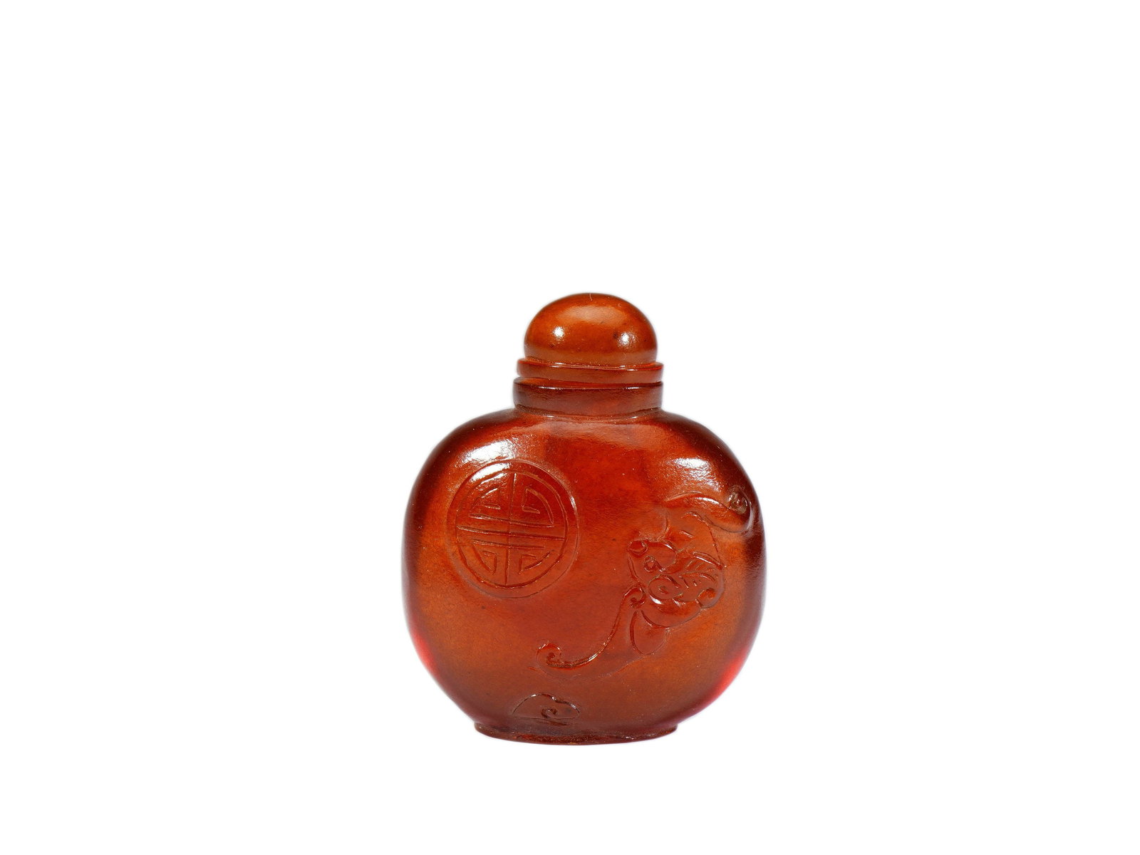 A Carved Amber Snuff Bottle: H: 5.6cmW: 4.7cm