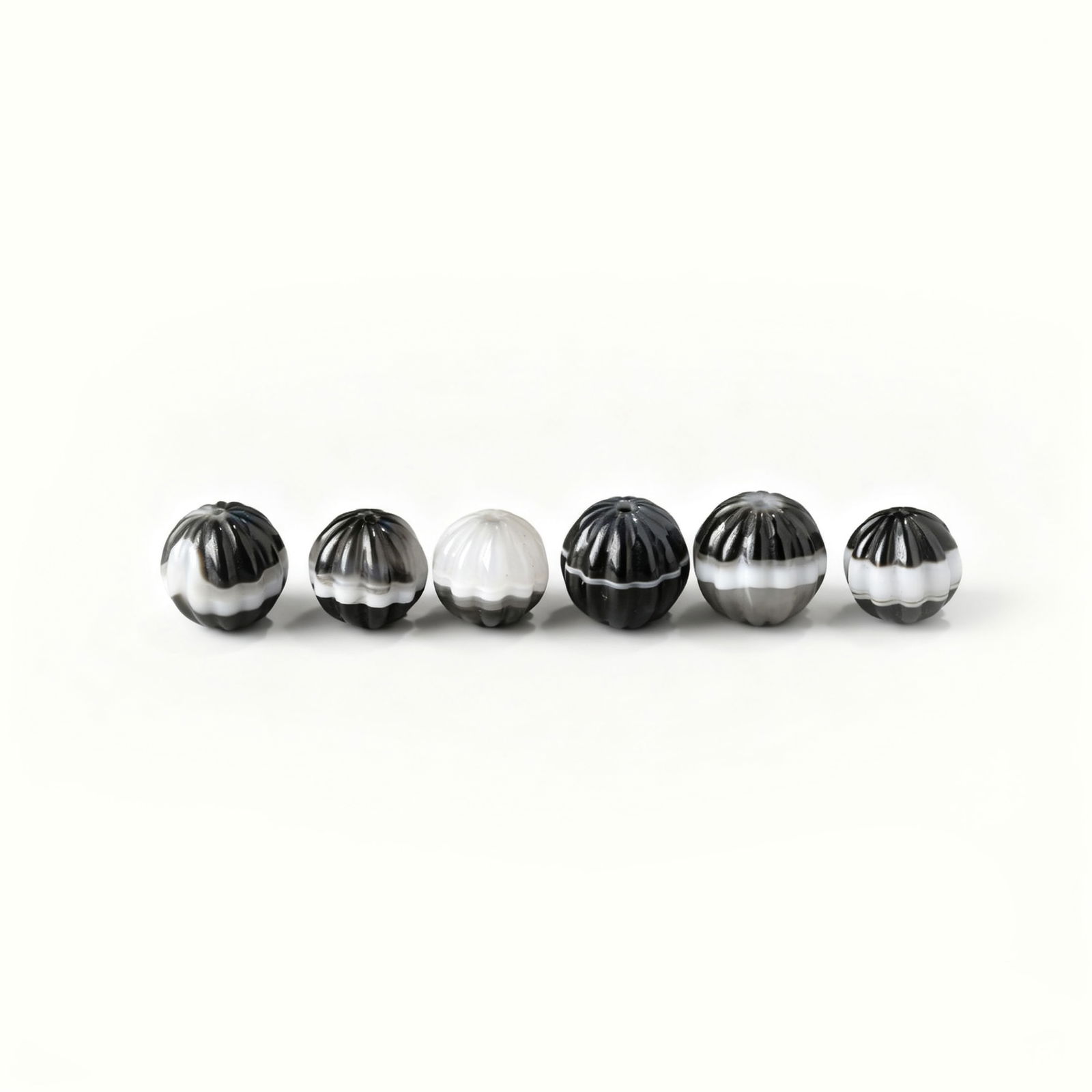 Group of 6 Indo-Tibetan Rami Banded Agate Beads – Unique Carvings: A set of six beautifully carved Indo-Tibetan rami banded agate beads, each featuring distinctive patterns and craftsmanship. weigh 44 g.