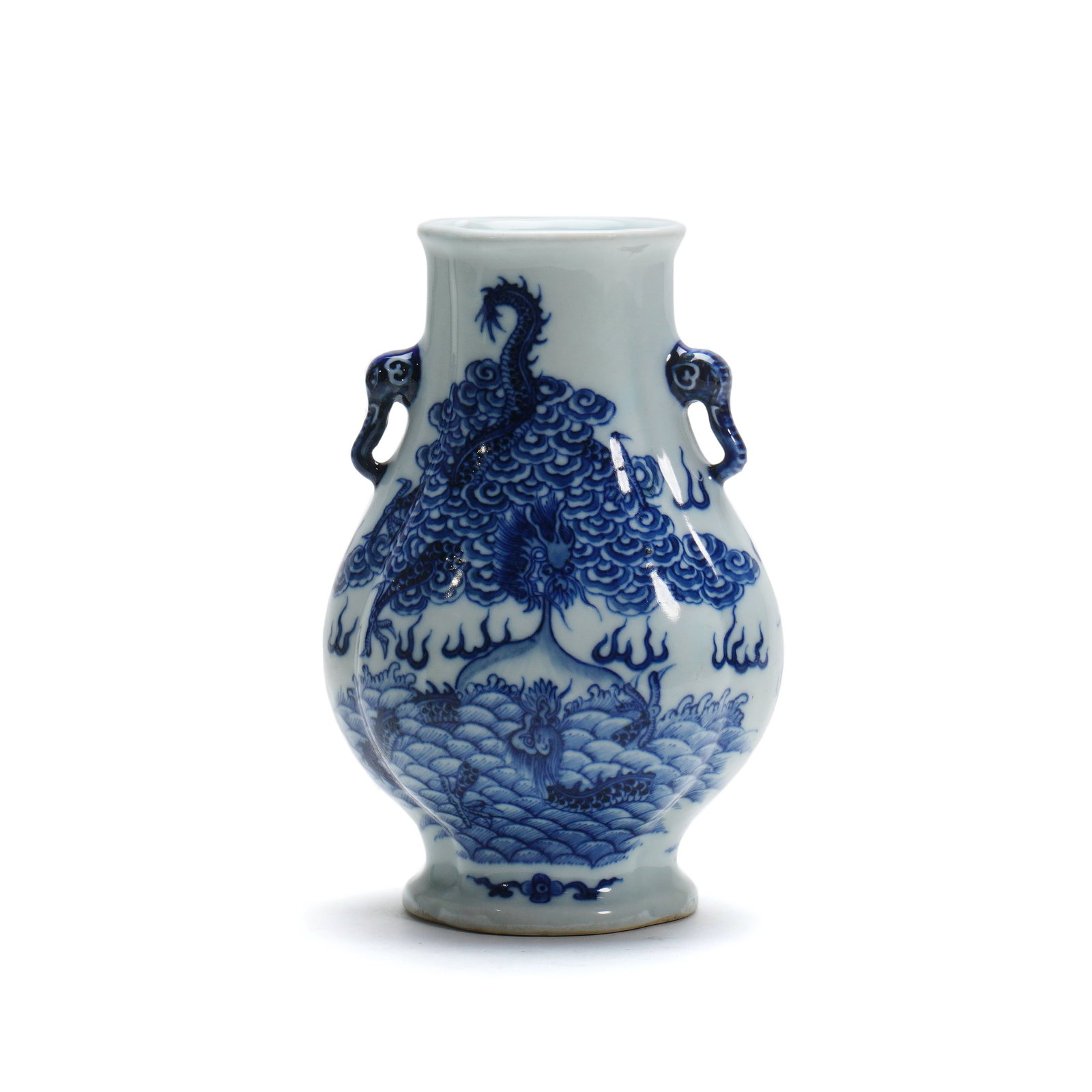 Qing Qianlong Blue-and-White Vase with Sea-Water Dragon Pattern and Double Elephant Handles: H :19.5cm W :13cm This Qing Qianlong Blue-and-White Vase with Sea-Water Dragon Pattern and Double Elephant Handles is a rare imperial blue-and-white dragon-pattern porcelain piece of the Qianlong peri