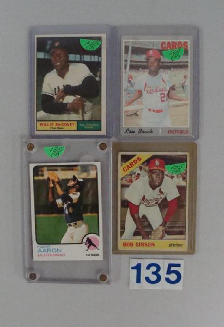 (4) TOPPS BASEBALL STARS: 1973 #100 H. AARON: - N.MT, 1966 #320 B. GIBSON - VG/EX, 1961 #517 W. McCOVEY - EX+/N.MT & 1970 #330 L. BROCK - GOOD