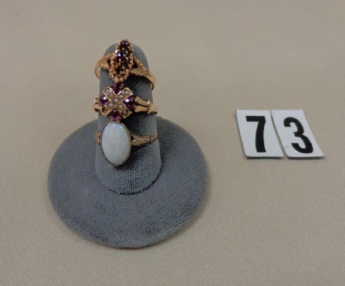 10 KT GOLD RING WITH WHITE OPAL STONE & A GOLD & RUBY (1 of 2)