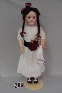 28 IN. GERMAN BISQUE HEAD DOLL: BY J.D. KESTNER, ORIGINAL COMPO BODY MARKED GERMANY, 5 3/4 IN RED ON BACK, ORIG. HUMAN HAIR WIG, ANTIQUE CLOTHES, VERY FAINT HAIRLINE ABOVE LEFT BROW WHICH IS VISIBLE WITH A LOOP - VERY GOOD