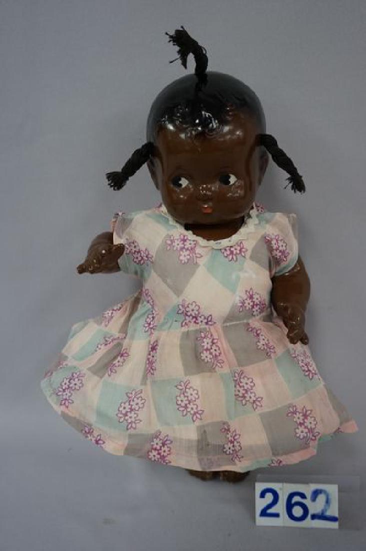 11 1/2 INCH ALL-COMPO BABY WITH ORIGINAL BROWN PAINT,: WITH ORIGINAL BROWN PAINT, JOINTED ARMS & LEGS, MOLDED HAIR WITH THREE TUFTS OF YARN HAIR, SIDE GLANCING PAINTED EYES, REAR OF HEAD & BACK ARE MARKED: EFFANBEE PATSY BABY - VERY GOOD