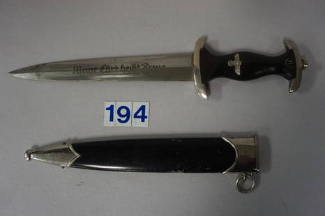 1936 EM SS DAGGER, OWNER IDENTIFIED,: HAS SS NO. ON CROSSGUARD, NICKEL FINISH FITTING, SCAFFING ON SCABBARD, GRIP SHOWS USE, ONE MINOR CHIP IN WOOD, BLADE IS EXCELLENT & MARKED: SS 807/36 RZM, LATER OWNER WAS 1944 SS STURMBANN FUHRER WALT