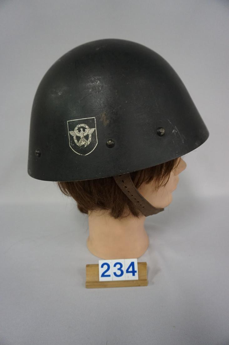 1938-1945 PROTECTARATE BOHEMIA & MORAVIC: CZECH ARMY HELMET M38, REUSED FOR POLICE DUTY BY THE GERMANS AS AN AUXILLIARY POLICE HELMET, BLACK PAINT WITH SINGLE POLICE DECAL INSIDE RETAINS ORIGINAL PAINT, MINOR LOSS TO DECAL OF WREATH BELOW SWA
