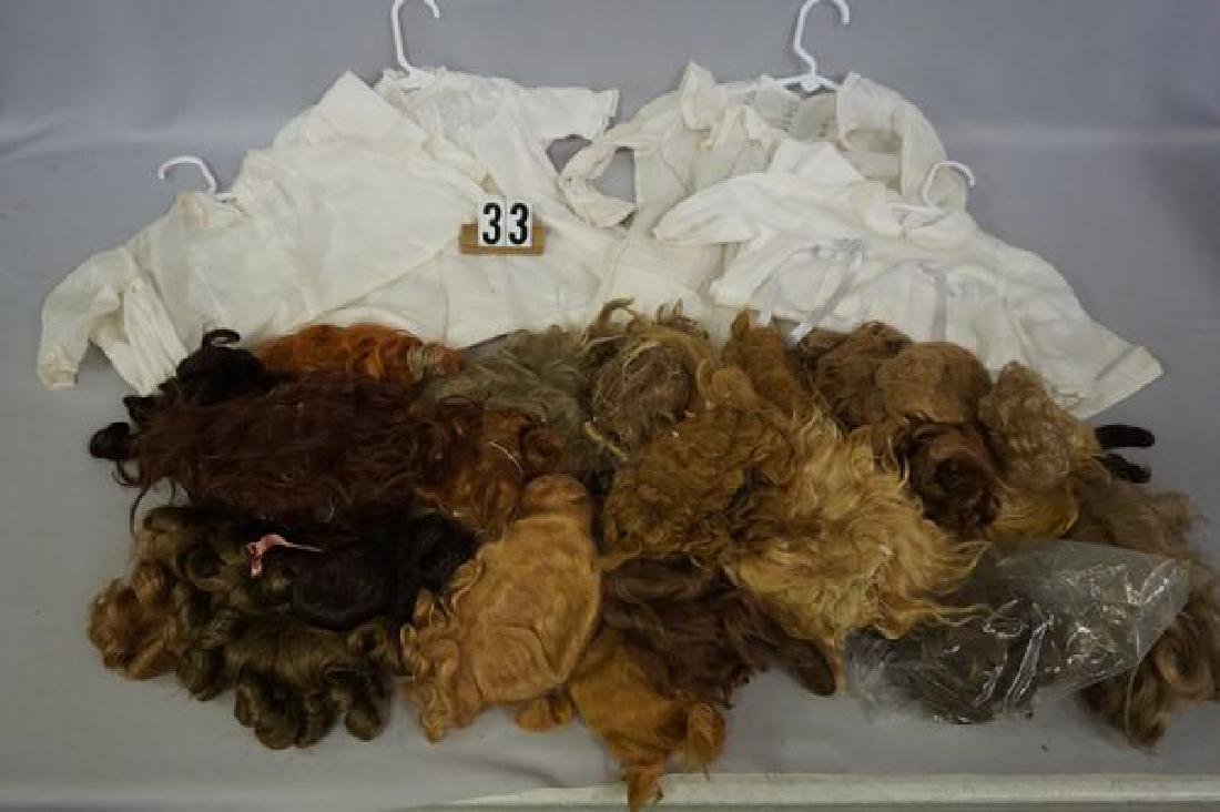 BOX OF ASSORTED SIZE & AGE DOLL WIGS - (1 of 3)