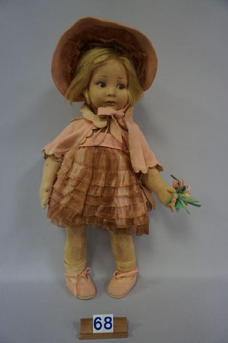 LENCI 21 INCH GIRL IN PINK WITH BONNET: HOLDING FLOWERS IN HER LEFT HAND, EXPOSED AREAS OF DOLL - FACE, ARMS, HANDS & LEGS ARE SOILED, DRESS IS BADLY SOILED & STAINED, JACKET IS SOILED & HAS MOTH HOLES - POOR