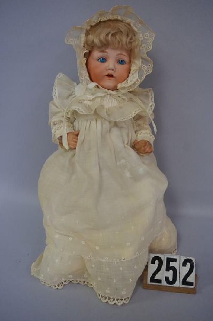 16 INCH BISQUE SOCKET HEAD CHARACTER FACE: BABY, EYES HAVE BEEN SET, RIGHT EYE WITH DAMAGE (PIECE BROKEN OUT), HEAD IS MARKED 86 RE WITHIN A DIAMOND NIPON (NIPPON), OPEN MOUTH, TWO TEETH & TONGUE, FIVE-PIECE BENT LIMB COMPO BODY, SOME WEAR ON 