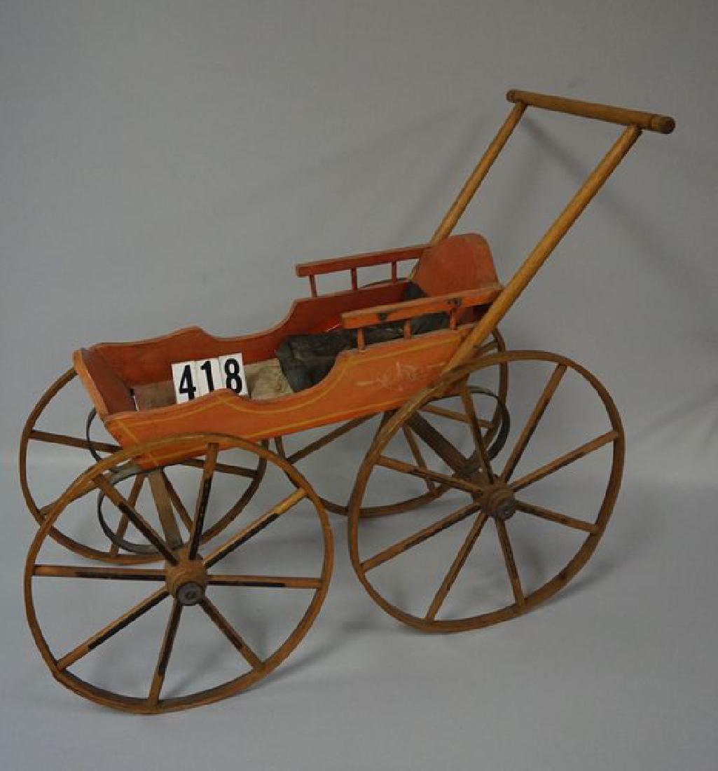 JOEL ELLIS STYLE WOODEN STROLLER: WITH ORIGINAL BENTWOOD WHEELS & WOODEN SPOKES, BODY OF STROLLER RETAINS ITS ORIGINAL PAINT, PINSTRIPING & DECOR, FOLD-OVER HOOD & THE ORNATE METAL FRAME FOR HOOD ARE MISSING, WOODEN HANDLE & SIDE EXTE