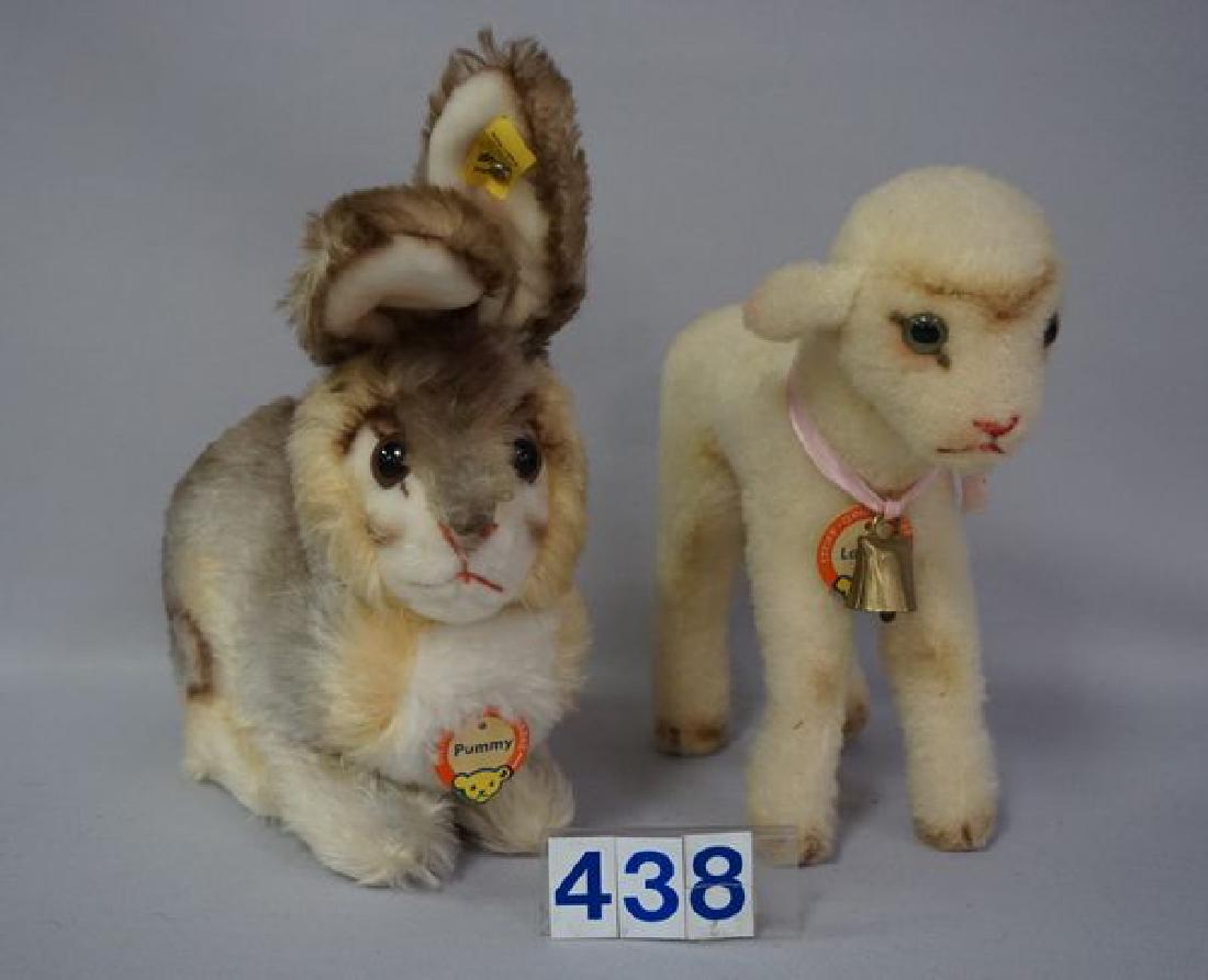(2 PIECES) STEIFF: LAMBY: 8 1/2 IN. H, 8 IN. L & PUMMY (RABBIT- SITTING POSITION) 9 1/2 IN. H, 8 1/2 IN. L, EACH WITH BUTTON & TAGS IN EARS & CHEST TAGS - EACH IS EXCELLENT
