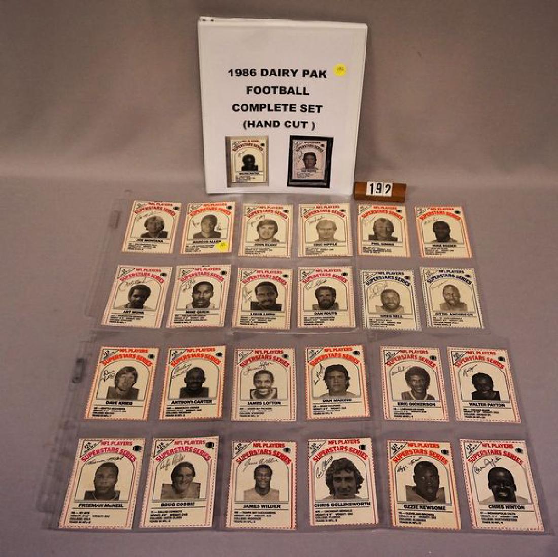 1986 DAIRY PAK FOOTBALL CARD SET: FROM SIDE PANELS OF MILK CARTONS, #1-24 IN BINDER, EACH CARD HAS BEEN NEATLY CUT FROM HALF GALLON CARTONS & DISPLAYED IN FOUR POCKET PLASTIC PAGES, INCLUDES MONTANA, ELWAY, FOUTS, SIMMS, LOFTON, MARIN