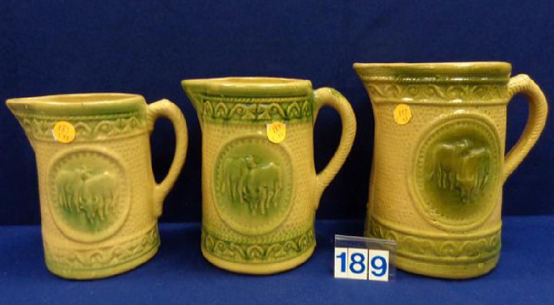 (3) ANTIQUE GRADUATED YELLOW WARE PITCHERS (1 of 6)