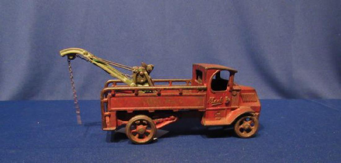 CAST IRON MACK WRECKER TRUCK:: 12 IN. RARE CAST IRON MACK TOW TRUCK, WORKING CHAIN, INCLUDES DRIVER, WEAVER BOOM - ORIGINAL PAINT SHOWS WEAR