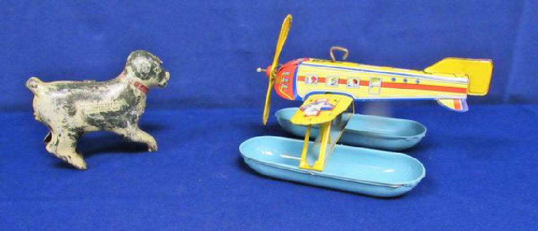 (2) VINTAGE WIND-UP TIN TOYS:: J. CHEIN AIRPLANE PLUS LANDSTROM 5 IN. "DANGING DOG" - BOTH VG WITH MINOR PAINT LOSS. WORKING CONDITION.
