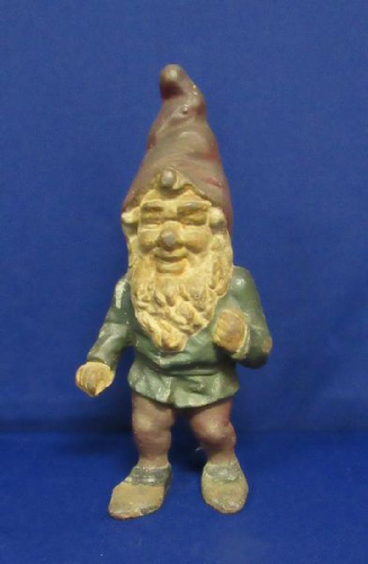12.5 IN. CAST IRON GNOME DOORSTOP:: ORIGINAL PAINT SHOWS WEAR. AGE UNKNOWN.
