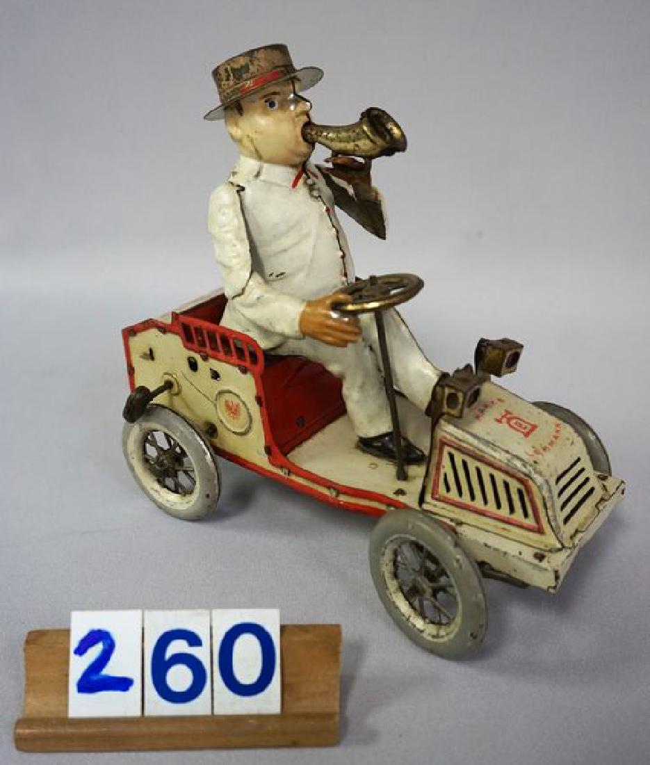 LEHMAN 'TUT TUT' WIND-UP: WITH BUILT IN KEY MECHANISM, 6 3/4 IN. L, 6 3/4 IN. H, WORKS BUT IS SLUGGISH & NEEDS SOME ATTENTION, BELLOWS PRODUCE SOUND, HAS SOME OVERALL WEAR WITH SOME PAINT LOSS ON HIGHER AREAS OF AUTO, ALL ORIG