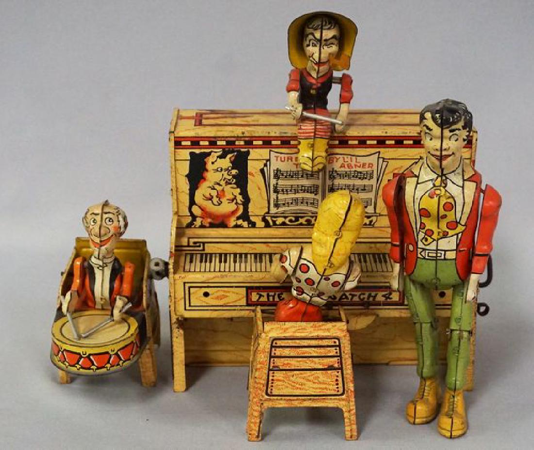 UNIQUE ART MANUFACTURING CO. INC.: LIL ABNER DOG PATCH BAND' TIN LITHO WIND-UP TOY (1945), 10 IN. W, 8 1/2 IN. H, ALL ORIGINAL & IN WORKING ORDER, NO MISSING PIECES, OVERALL LIGHT WEAR & SCRATCHES IN SOME AREAS - GOOD